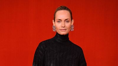 Amber Valletta's simple kitchen cabinet color embraces the organic modern trend that is huge in 2024