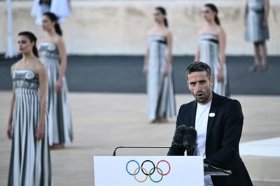 Greece Hands Olympic Flame To 2024 Paris Games Hosts