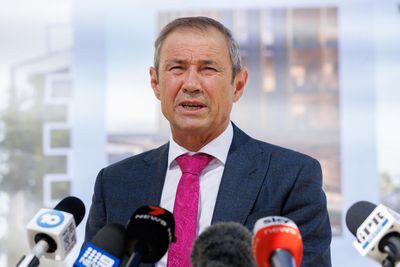 Two 17-year-old climate activists claim WA premier Roger Cook defamed them over Woodside protest