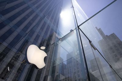 Apple iPhone sales plunge, as shares rise on dividend, stock buyback news