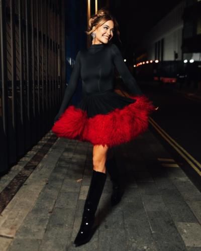 Rita Ora Stuns In Vibrant Red And Black Ensemble