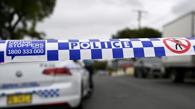 Man on the run after stabbing woman outside Sydney gym