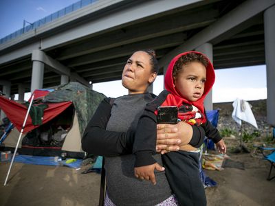 Migrant arrivals stretched Denver's budget. Now, the city is scaling back aid