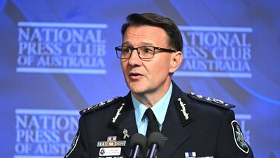 Federal police commissioner gets two more years in role