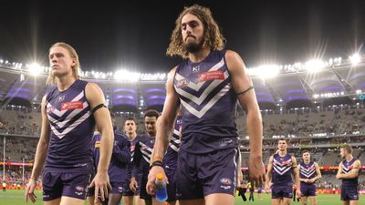 Swans crush mourning Dockers on day of sadness