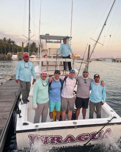 Fishing Fun: Friends Enjoying A Day On The Water