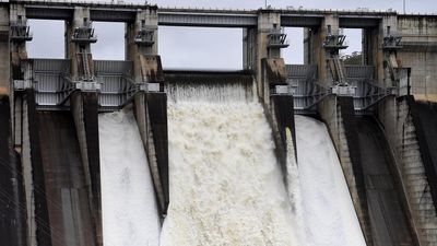 Sydney dam spilling as swathes of NSW cop more rain