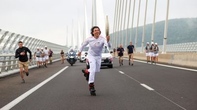 Crowds greet Olympic torch travelling through France under tight security