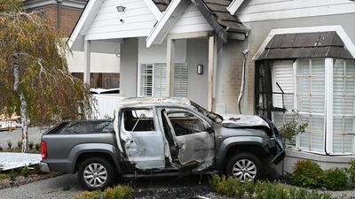 Two burning cars crash into Melbourne house