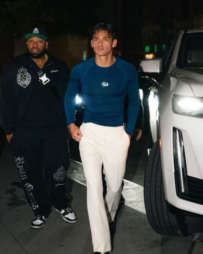 Ryan Garcia's Effortlessly Stylish Blue Shirt And White Pants Look