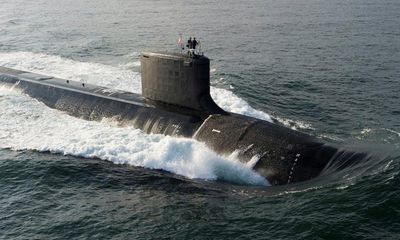 Federal budget ramps up Aukus with $2.6bn earmarked for submarine project in 2024-25