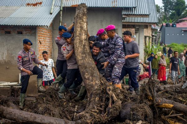 Indonesia Floods Kill 58 As Rescuers Race To Find Missing