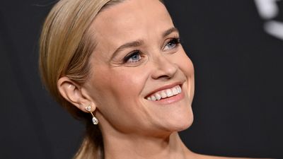 Reese Witherspoon's full fringe, frilly white sundress and cherry red pedicure is a dreamy style hat-trick