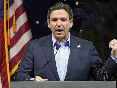 Florida Gov. Ron DeSantis signs a bill that strikes climate change from state law
