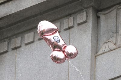 Phallic balloons fly at Trump trial