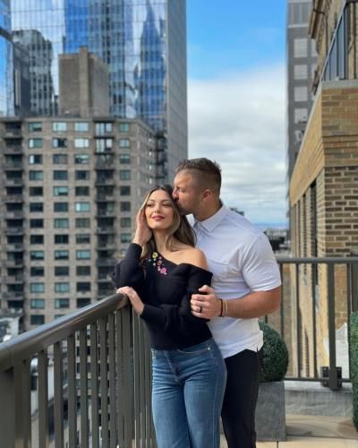 Tim Tebow And Wife Radiate Elegance In Balcony Photo