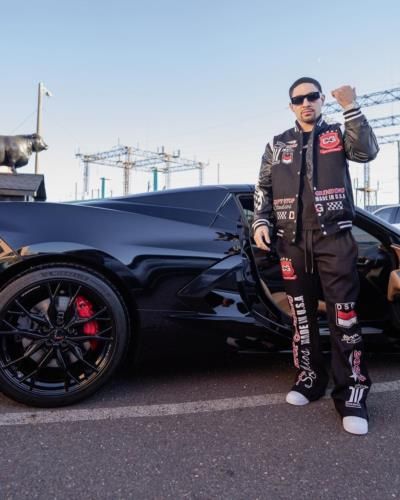 Danny Garcia Showcases Edgy Style Next To Black Car