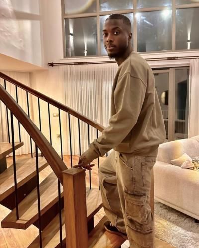 Nicolas Pepe's Urban Cool: Grey Cargo Pants And Skin-Colored Sweatshirt