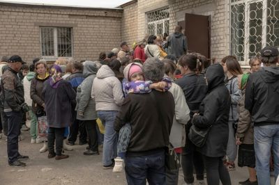 'Get Out Now': Kharkiv Region Evacuees Wait For Stranded Relatives