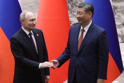 Putin and Xi further their embrace to defy U.S.-led pressure