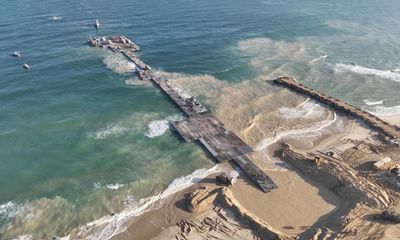 Hamas ‘rejects’ any military presence in Gaza as aid begins to arrive along US-made pier –  as it happened