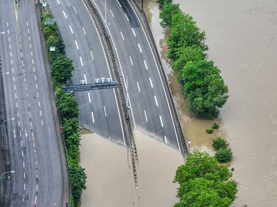 The German chancellor tours flooded regions in the southwest in a show of solidarity