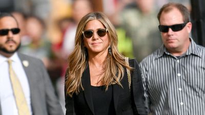 Jennifer Aniston's flared jeans and T-shirt nail casual sophistication - and layered chains add just the right amount of edge