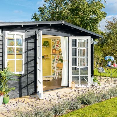 This summerhouse has been turned into an uplifting space to work with bright florals and sunny colours