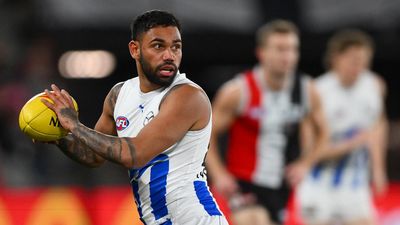 Ex-AFL player Tarryn Thomas charged over phone calls