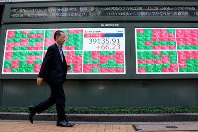 Stock market today: Asian shares mostly decline after Nasdaq ticks to a record high