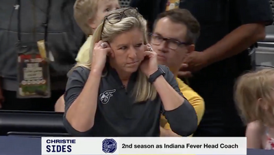 Fever coach Christie Sides looked so distracted by ESPN’s TV interview during a close fourth quarter