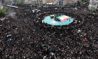 Tens of thousands fill streets of Tehran for Iranian president’s funeral