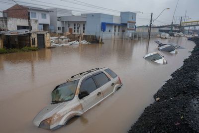Brazil's flooded south sees first death from disease, as experts warn of coming surge in fatalities