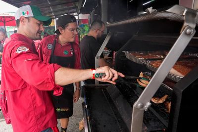 At the 'Super Bowl of Swine,' global barbecuing traditions are the wood-smoked flavor of the day