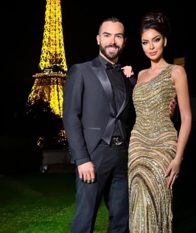Stylish Couple Captured In Front Of Iconic Eiffel Tower