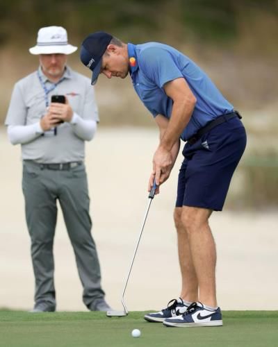 Justin Rose Improving Golf Game In Stylish Navy Blue Attire