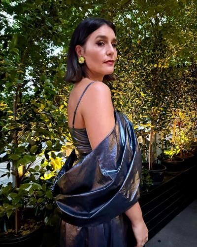 Jessie Ware Stuns In Stylish Dress Against Lush Plant Backdrop