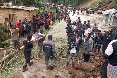 Rescuers search rubble after over 300 buried in Papua New Guinea landslide