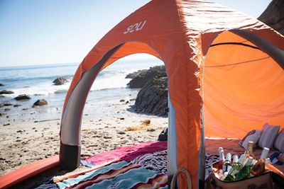 This self-inflating canopy is a genius hack for beach days — and it's the perfect gift for outdoorsy dads