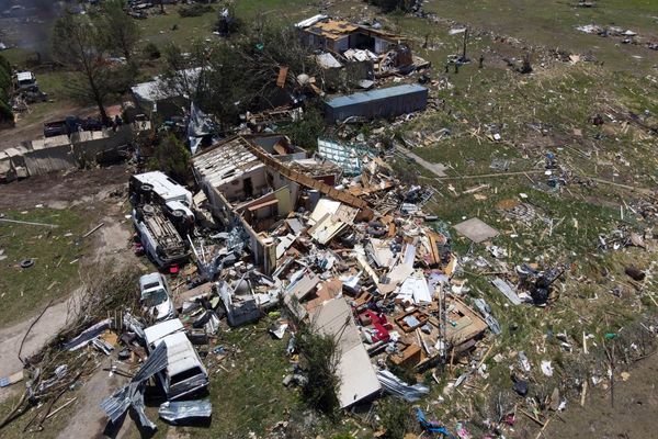 Two children among at least 14 dead after severe storms tear across US