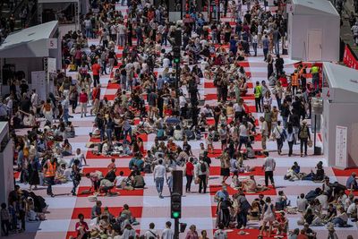 Paris' traffic-clogged Champs-Elysees turned into a mass picnic blanket for an unusual meal