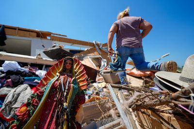 In a north Texas county, dazed residents sift through homes mangled by a tornado