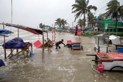 Cyclone floods coastal villages and cuts power in Bangladesh, where 800,000 had evacuated