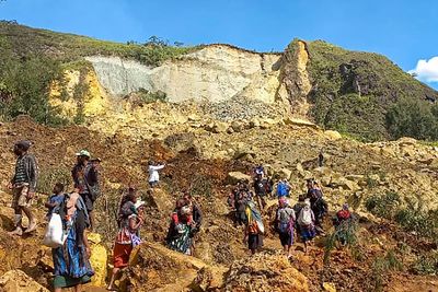 Australia plans to send aid to Papua New Guinea as rain raises safety fears at deadly landslide site