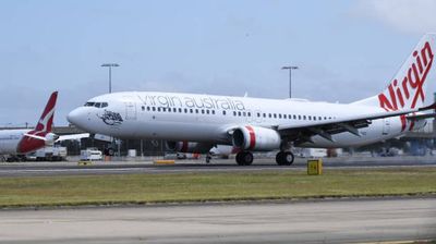 Virgin Airlines flight returns to Perth airport after 'Passenger runs naked through plane'