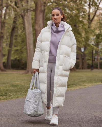 Dascha Polanco Stuns In White Coat And Grey Bag Photoshoot