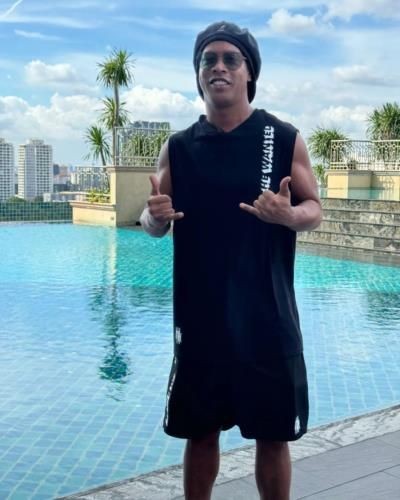 Ronaldinho Radiates Charm And Style By The Poolside