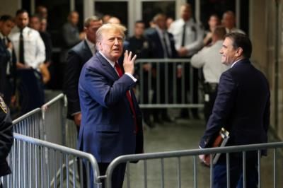 Donald Trump Smiles And Speaks With Attorney During Jury Deliberations