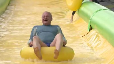Lib Dem leader Sir Ed Davey tries out waterslide in latest election stunt