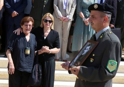 Families reclaim the remains of 15 recently identified Greek soldiers killed in Cyprus in 1974